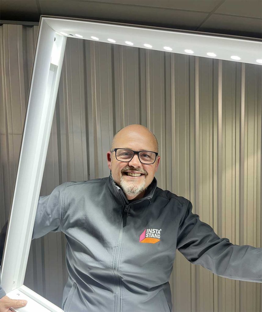 James Dunman - Founder of Instastand, being framed by one of their Lightbox frames